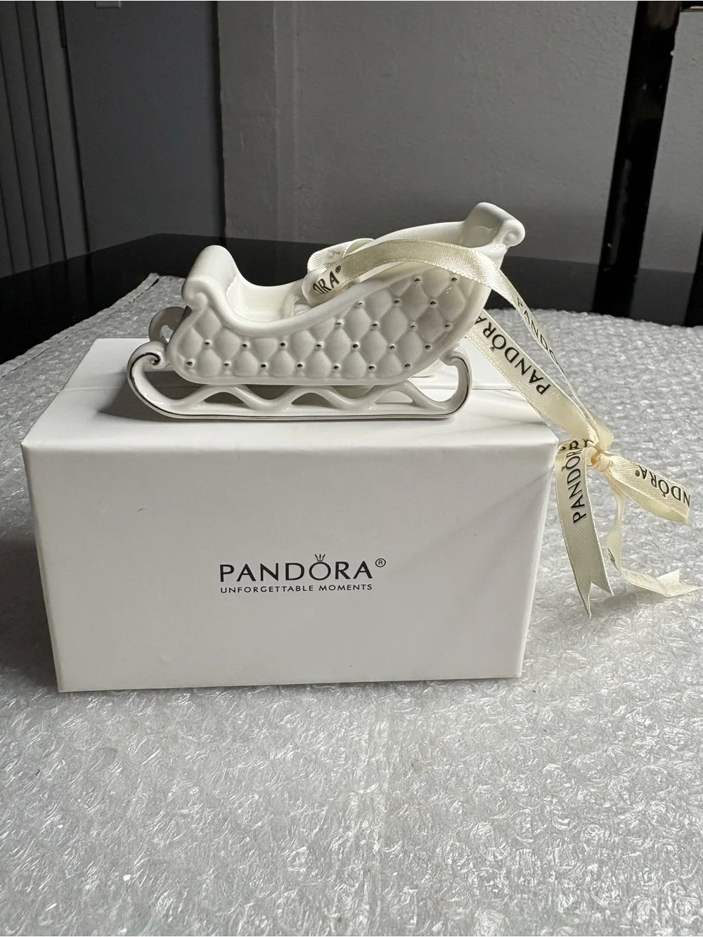 Pandora white porcelain sleigh ornament